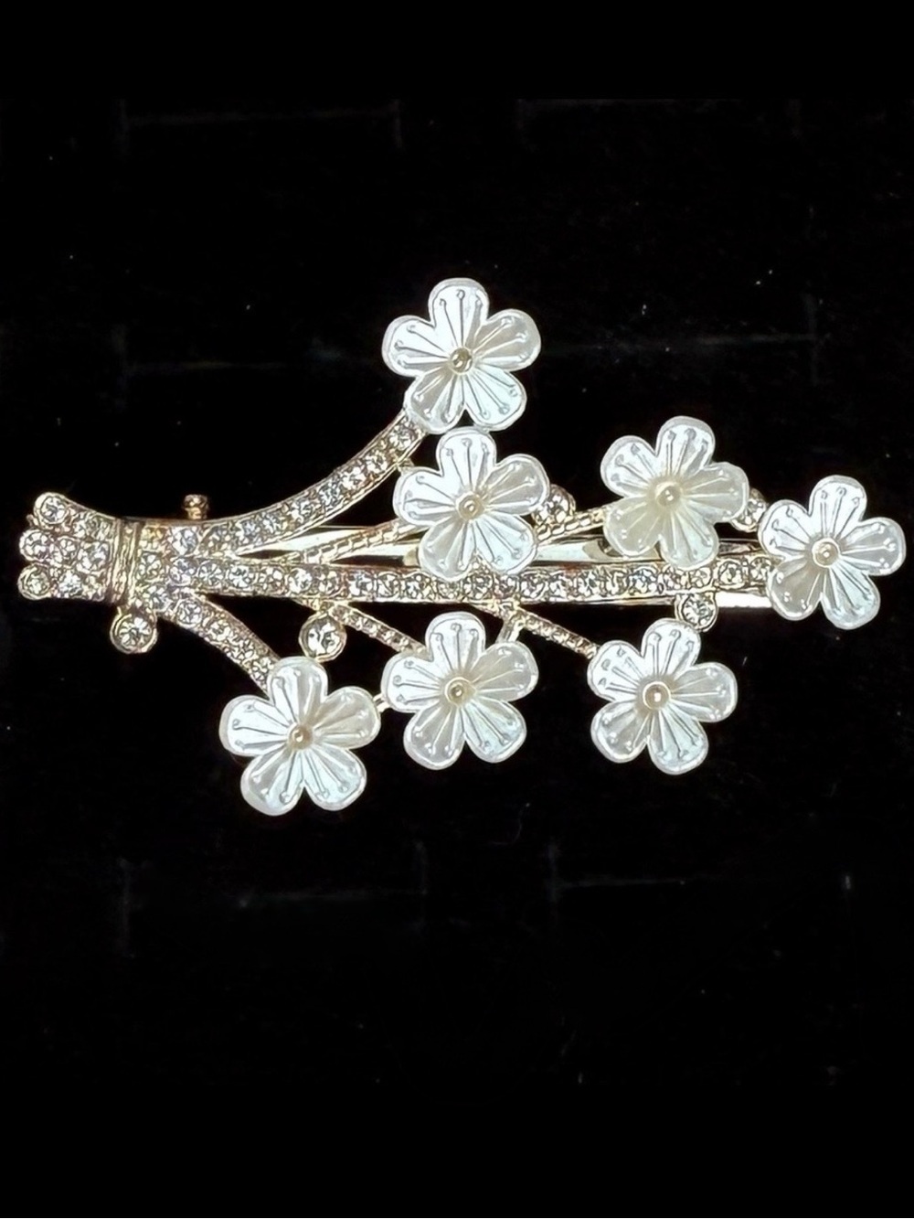 Silvertone floral hair clip, rhinestones and faux pearl accent